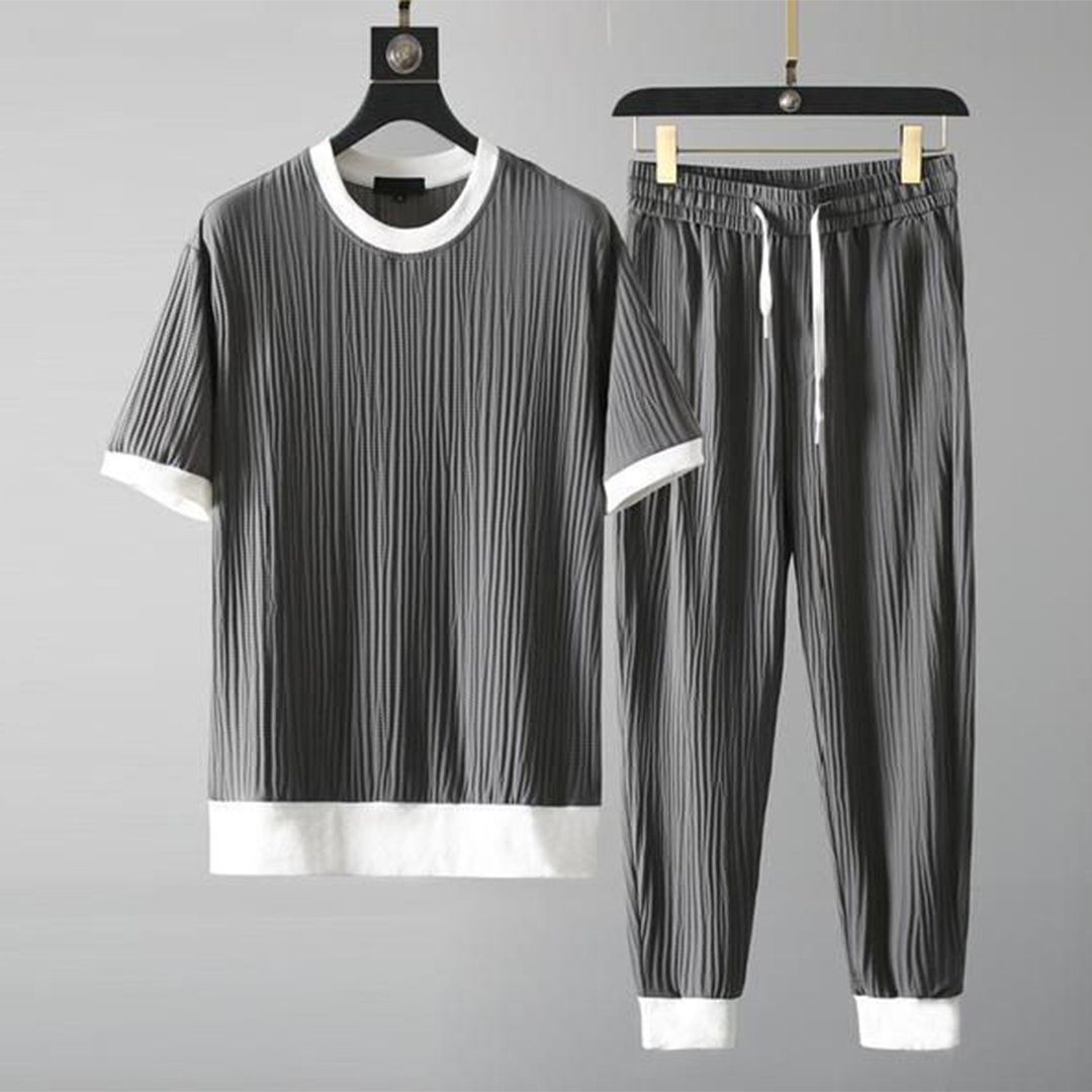 Mäns casual set för höst med O-hals tröja och avslappnade byxor i blå, svart, grå och vit för stil och komfort.