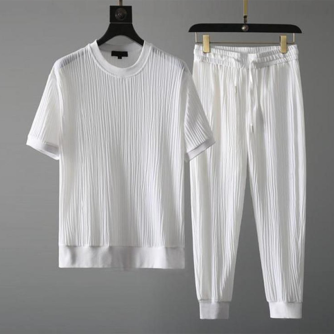 Mäns casual set för höst med O-hals tröja och avslappnade byxor i blå, svart, grå och vit för stil och komfort.