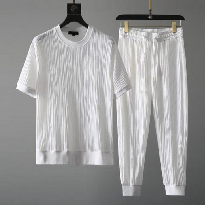 Mäns casual set för höst med O-hals tröja och avslappnade byxor i blå, svart, grå och vit för stil och komfort.