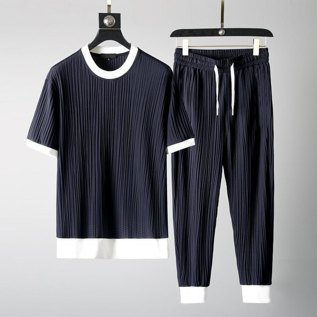 Mäns casual set för höst med O-hals tröja och avslappnade byxor i blå, svart, grå och vit för stil och komfort.