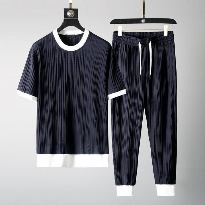 Mäns casual set för höst med O-hals tröja och avslappnade byxor i blå, svart, grå och vit för stil och komfort.