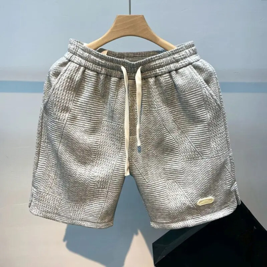 "Mäns sportshorts med vågmönster, justerbar midja och bekväm passform, perfekt för träning och fritid."