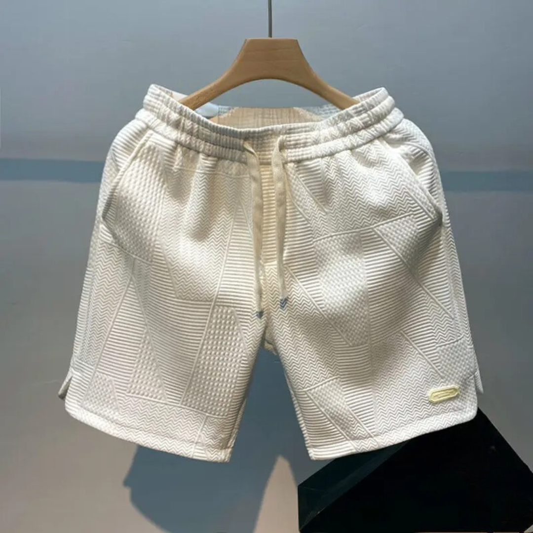 "Mäns sportshorts med vågmönster, justerbar midja och bekväm passform, perfekt för träning och fritid."