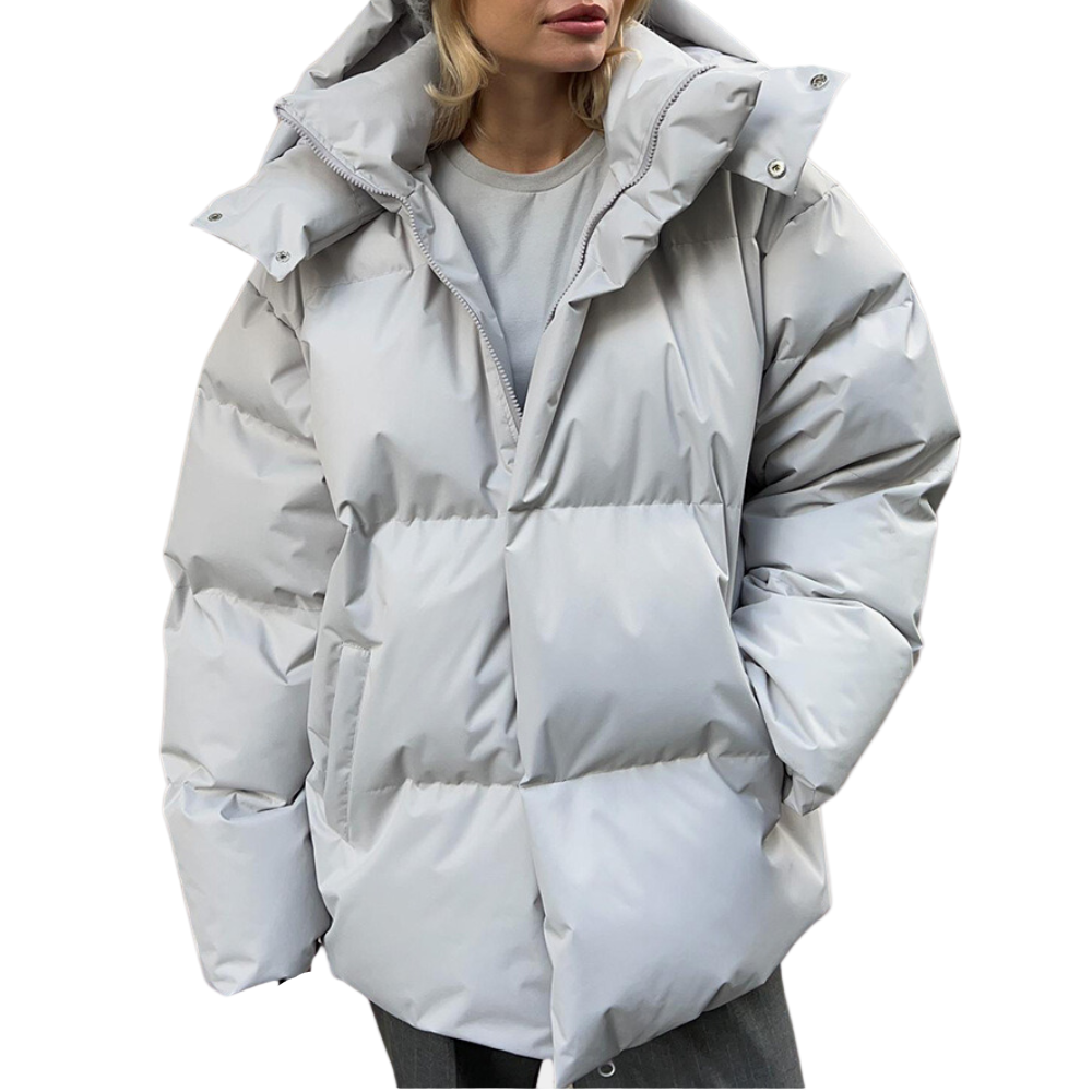 "Modern dam vinterjacka puffer med elegant design och rymlig passform, perfekt för stil och värme i stad och natur."