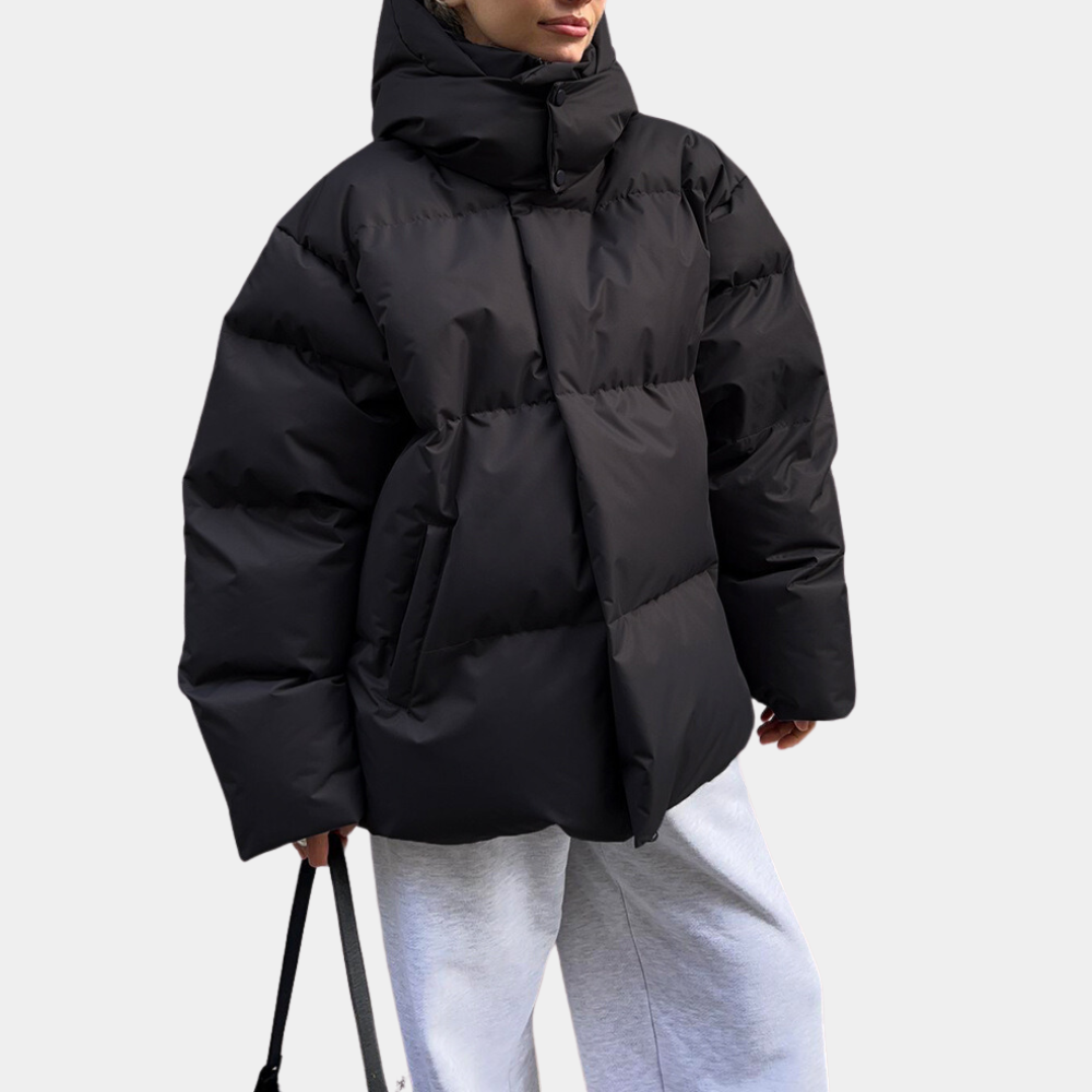 "Modern dam vinterjacka puffer med elegant design och rymlig passform, perfekt för stil och värme i stad och natur."