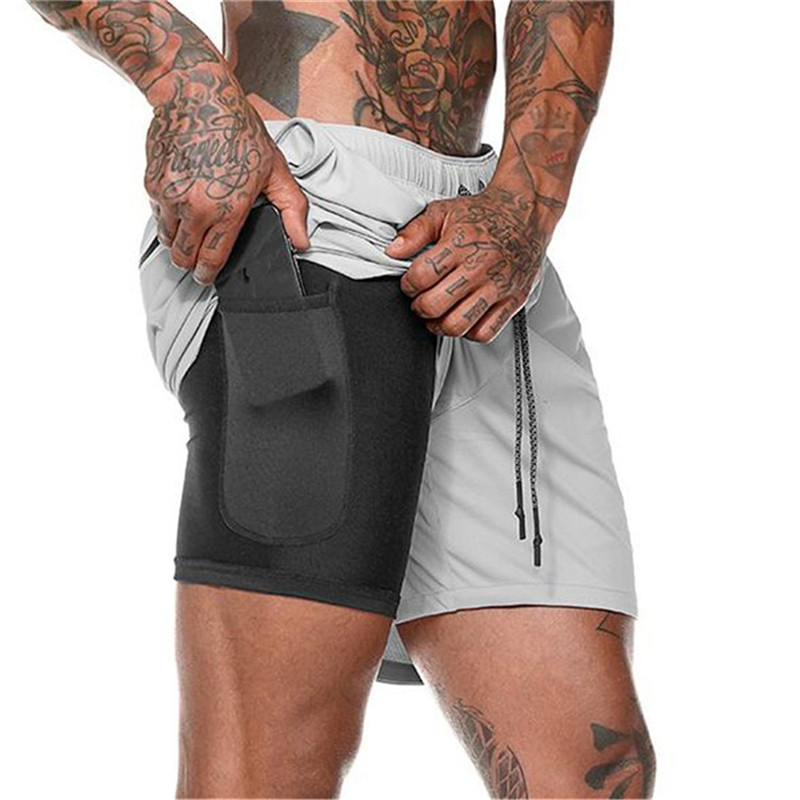 "Moderna strandshorts för män, dubbla lager med elastisk midja, dragsko och fickor i blått. Snabbtorkande material."