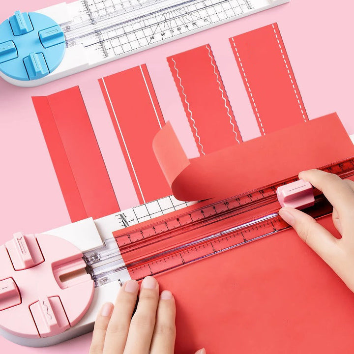 "Multifunktionell 4-i-1 pappersskärare i rosa och blå plast, perfekt för hantverk som scrapbooking med precisionsskärning."