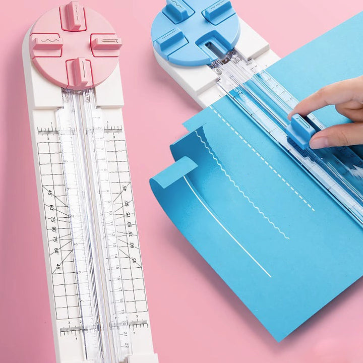 "Multifunktionell 4-i-1 pappersskärare i rosa och blå plast, perfekt för hantverk som scrapbooking med precisionsskärning."