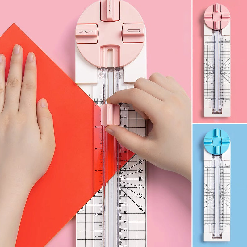 "Multifunktionell 4-i-1 pappersskärare i rosa och blå plast, perfekt för hantverk som scrapbooking med precisionsskärning."