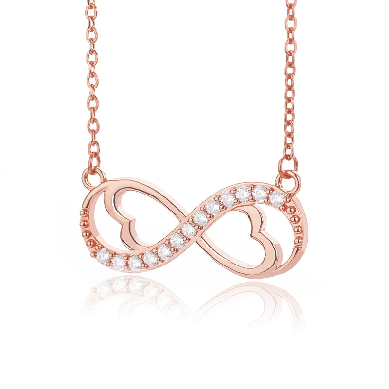 Oändlighetshalsband i silver med glittrande zirconia, elegant design för kvinnor, perfekt present och justerbar kedja.