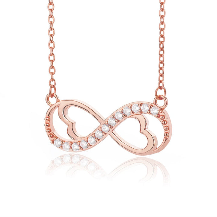 Oändlighetshalsband i silver med glittrande zirconia, elegant design för kvinnor, perfekt present och justerbar kedja.