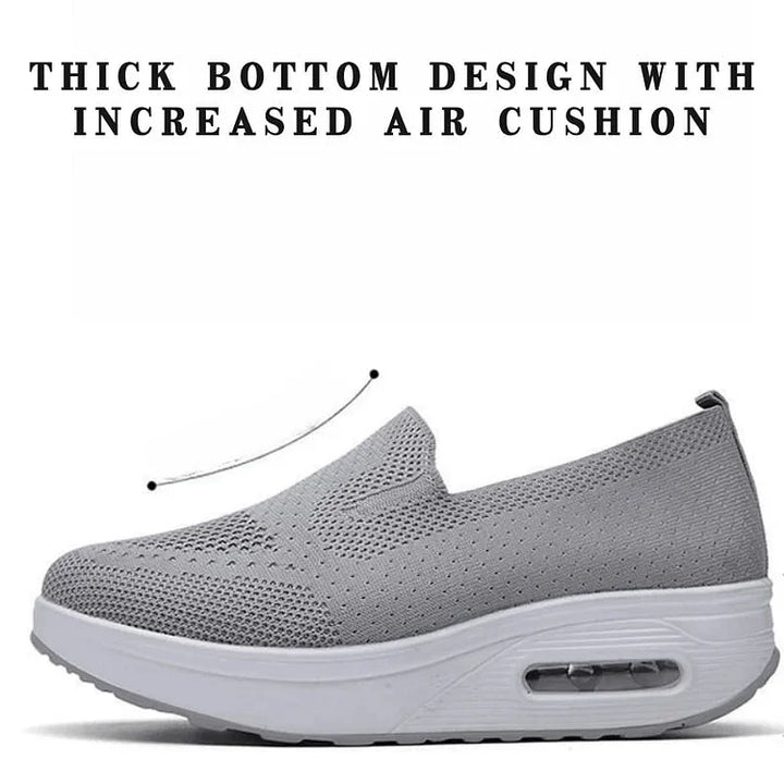 Ortopediska sneakers för kvinnor i grått, andningsbart syntetmaterial, ortopediskt stöd och enkel snörning.