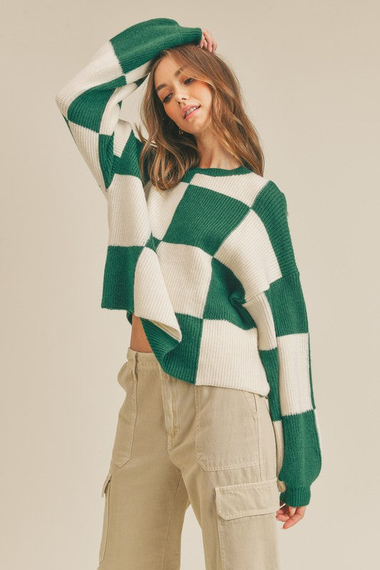 "Oversized grön damtröja med rutigt mönster, pullover stil för mode och komfort."