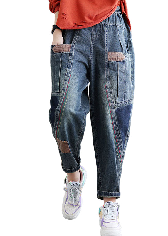 "Patchwork denimbyxor med praktiska fickor, hög midja och lös passform, idealiska för damernas höstmode."