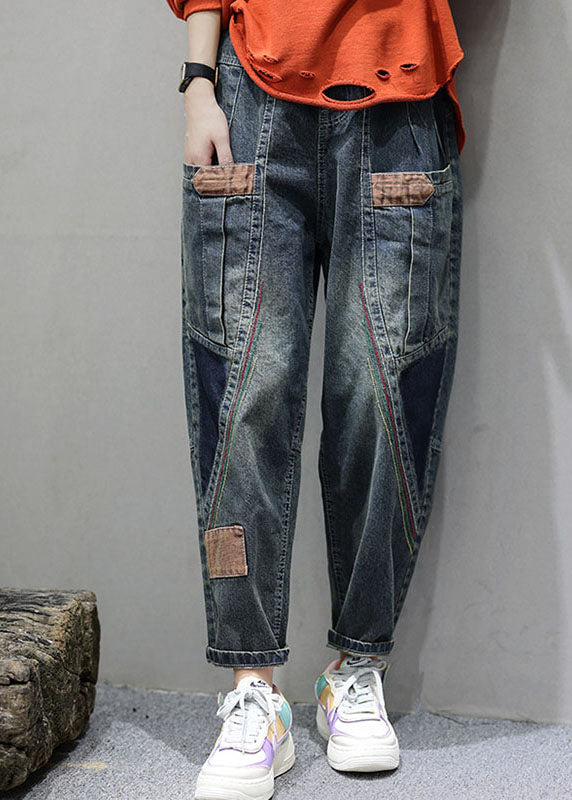 "Patchwork denimbyxor med praktiska fickor, hög midja och lös passform, idealiska för damernas höstmode."