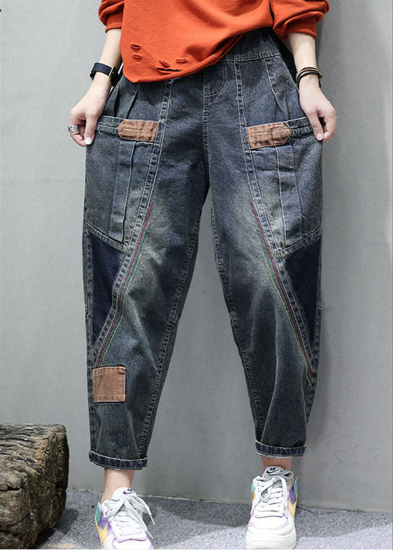 "Patchwork denimbyxor med praktiska fickor, hög midja och lös passform, idealiska för damernas höstmode."