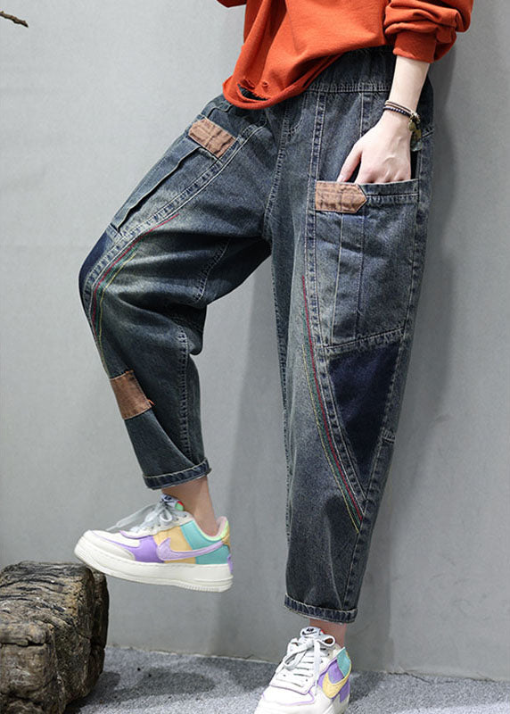 "Patchwork denimbyxor med praktiska fickor, hög midja och lös passform, idealiska för damernas höstmode."