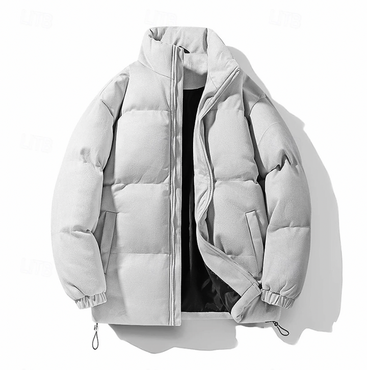 "Quiltad herr vinterjacka i modern stil, elegant design, svart färg, värmande och bekväm för kalla dagar, lätt att styla."