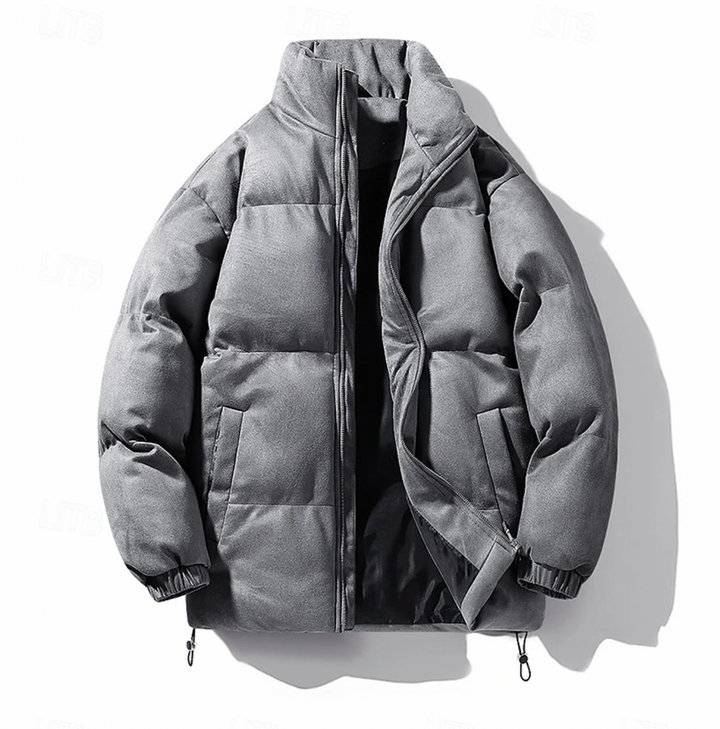 "Quiltad herr vinterjacka i modern stil, elegant design, svart färg, värmande och bekväm för kalla dagar, lätt att styla."