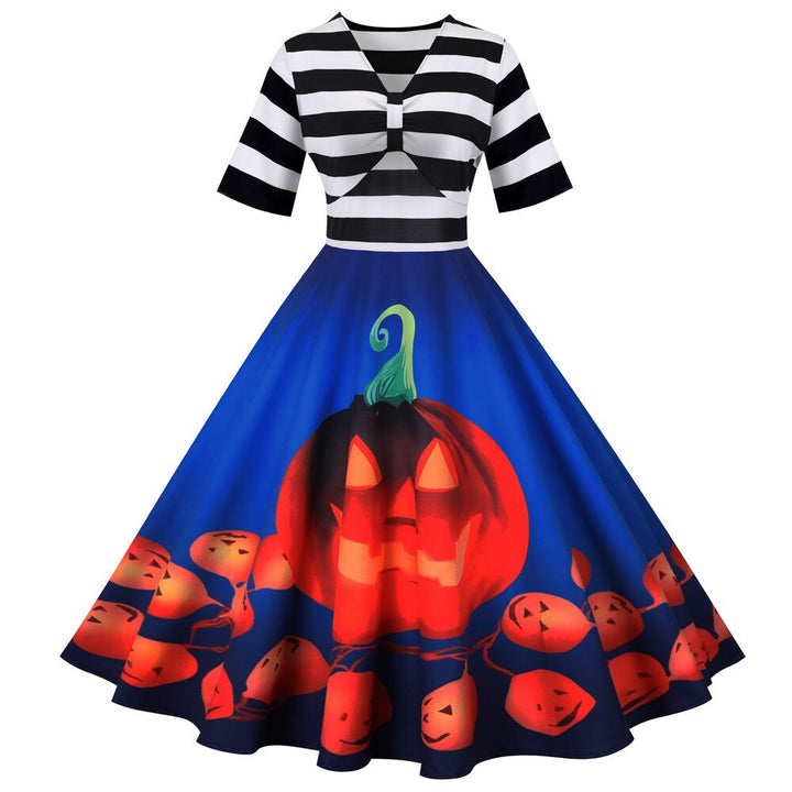 "Retro damklänning med pumpamotiv i mjukt tyg, midi-längd, perfekt för Halloween-fester och höstfiranden."