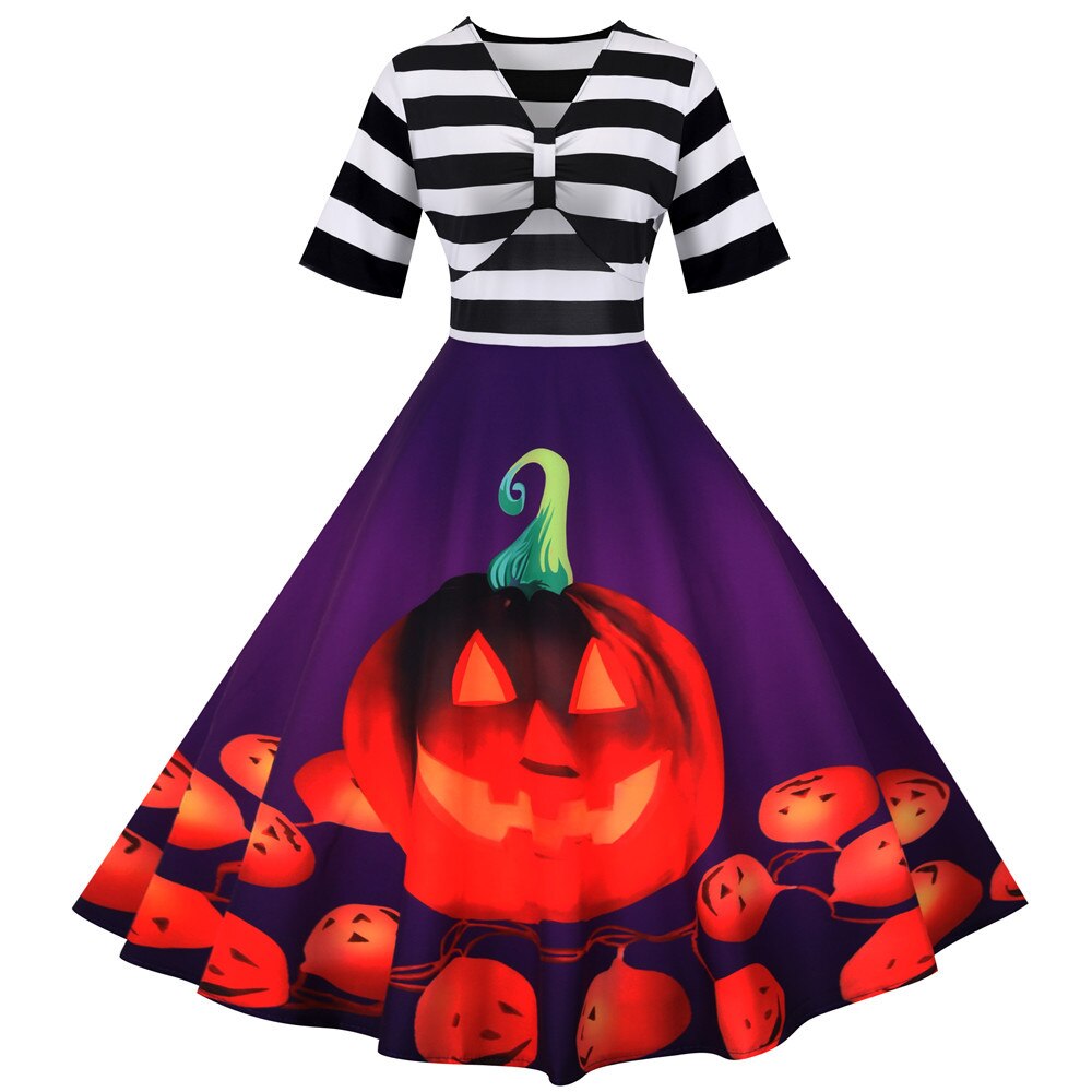 "Retro damklänning med pumpamotiv i mjukt tyg, midi-längd, perfekt för Halloween-fester och höstfiranden."