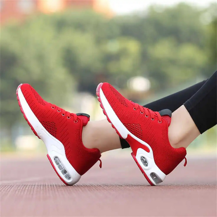 "Snygga dam sneakers med hålfotsstöd och luftkuddar, gråa och vita, perfekt för komfort och aktiv livsstil."