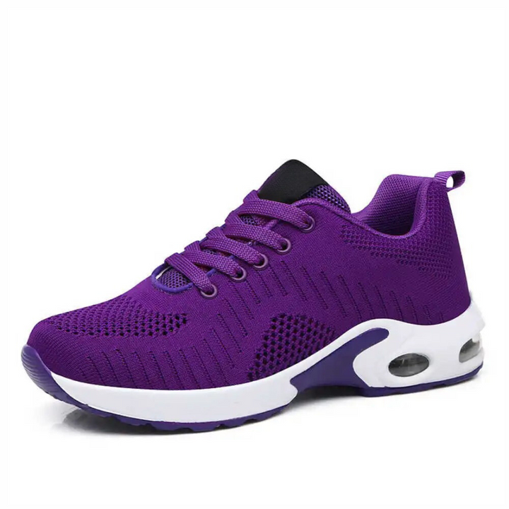"Snygga dam sneakers med hålfotsstöd och luftkuddar, gråa och vita, perfekt för komfort och aktiv livsstil."