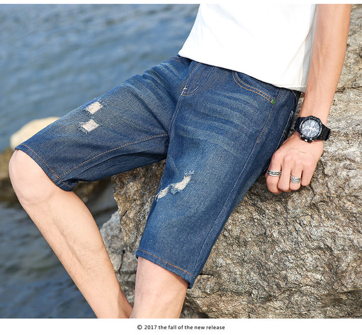 "Somriga tvättbara jeansshorts med perforeringar för män, knälånga och lös passform med funktionella fickor."