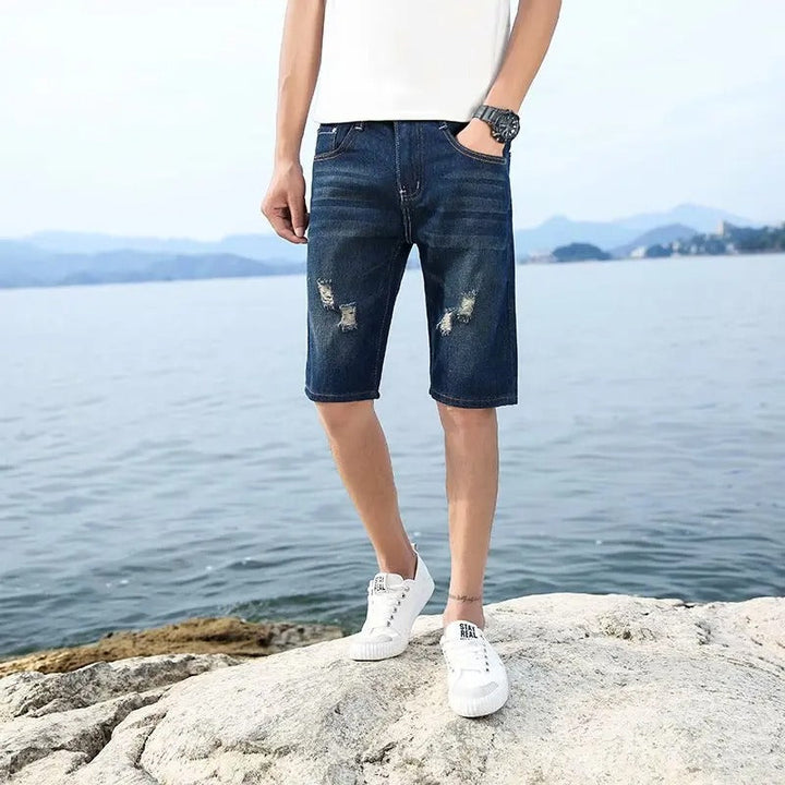 "Somriga tvättbara jeansshorts med perforeringar för män, knälånga och lös passform med funktionella fickor."