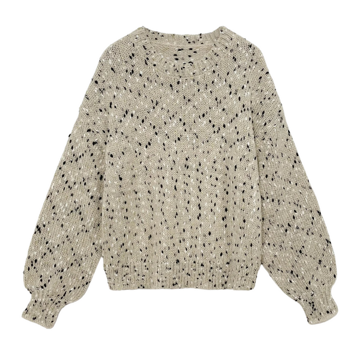 "Stickad damtröja med O-hals, prickar och drop shoulder-design, i akrylmaterial för stil och komfort."