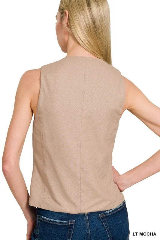 "Stilren dam dunväst i linne-stil, knäppt design med fickor, lätt material perfekt för alla säsonger."