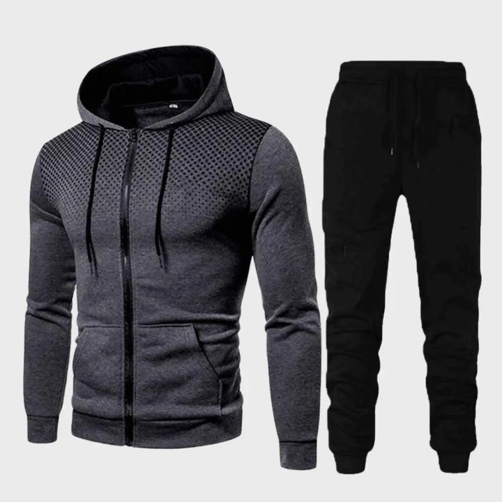 "Stilrent herrträningsset med hoodie och joggingbyxor, modern passform, mjukt material i trendiga färger."