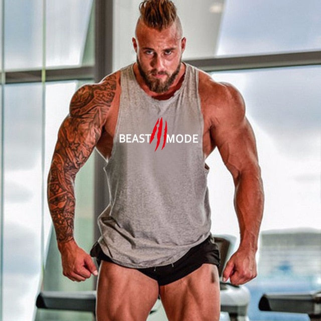 "Svart Beast Mode linne för gym, ärmlös med Y-formad rygg, framhäver muskulös fysik, perfekt för träning och avslappning."