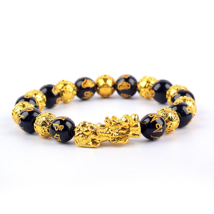 "Svart obsidian armband med Pi Xiu-detaljer, eleganta pärlor för rikedom och skydd, perfekt damaccessoar."