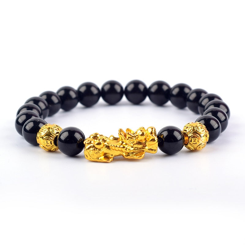 "Svart obsidian armband med Pi Xiu-detaljer, eleganta pärlor för rikedom och skydd, perfekt damaccessoar."