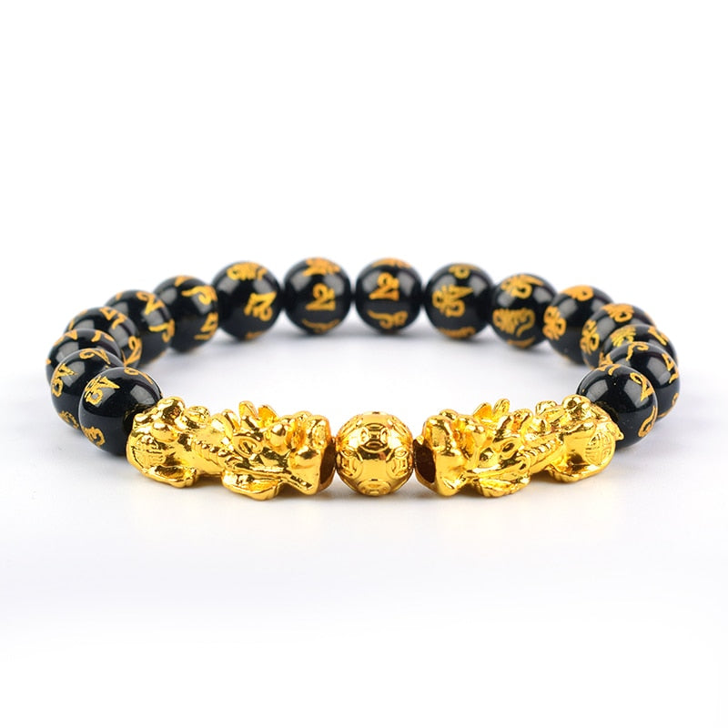 "Svart obsidian armband med Pi Xiu-detaljer, eleganta pärlor för rikedom och skydd, perfekt damaccessoar."