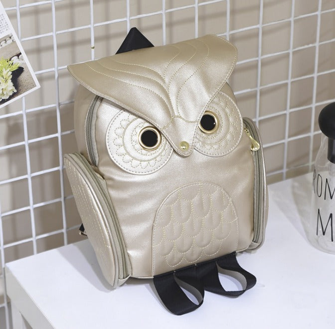 "Trendig uggla ryggsäck i PU-läder med flerficka för kvinnor, uggla-mönster, elegant design i ljusrosa och svart."