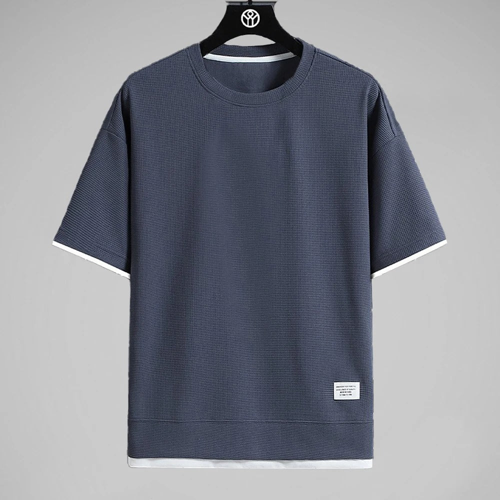 "Ultramjuk herr våffel-T-shirt i premiumkvalitet med kort ärm och ventilerande struktur, stilfull och bekväm look."