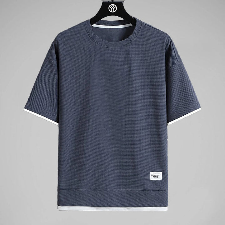 "Ultramjuk herr våffel-T-shirt i premiumkvalitet med kort ärm och ventilerande struktur, stilfull och bekväm look."