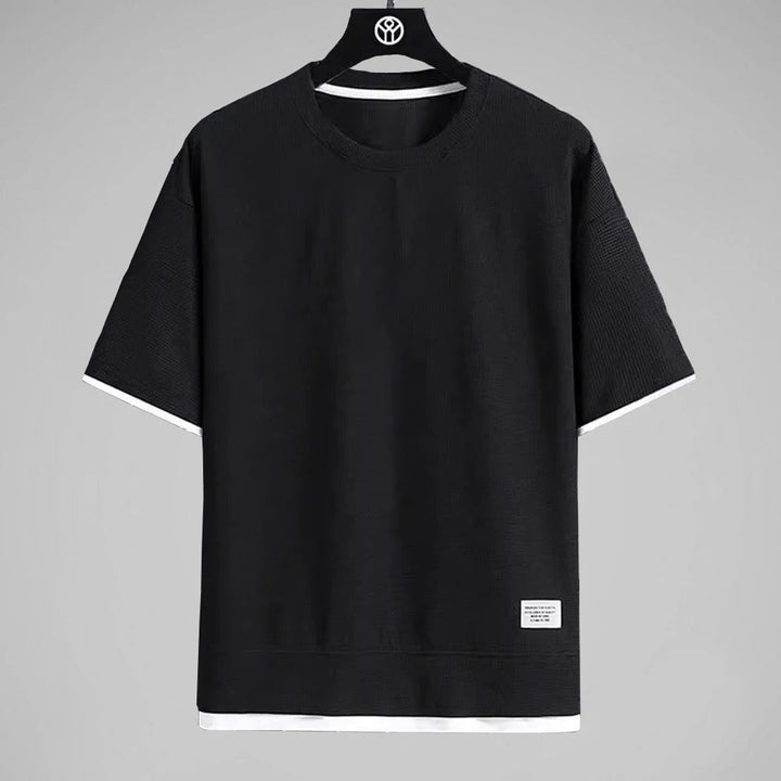 "Ultramjuk herr våffel-T-shirt i premiumkvalitet med kort ärm och ventilerande struktur, stilfull och bekväm look."