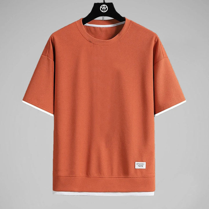 "Ultramjuk herr våffel-T-shirt i premiumkvalitet med kort ärm och ventilerande struktur, stilfull och bekväm look."
