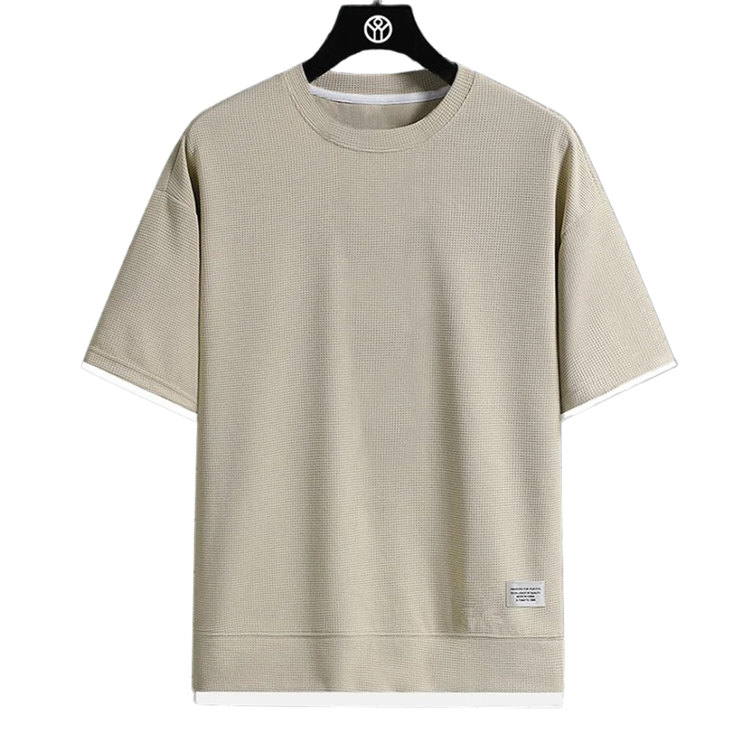 "Ultramjuk herr våffel-T-shirt i premiumkvalitet med kort ärm och ventilerande struktur, stilfull och bekväm look."