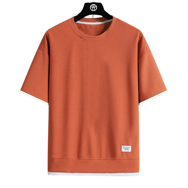"Ultramjuk herr våffel-T-shirt i premiumkvalitet med kort ärm och ventilerande struktur, stilfull och bekväm look."