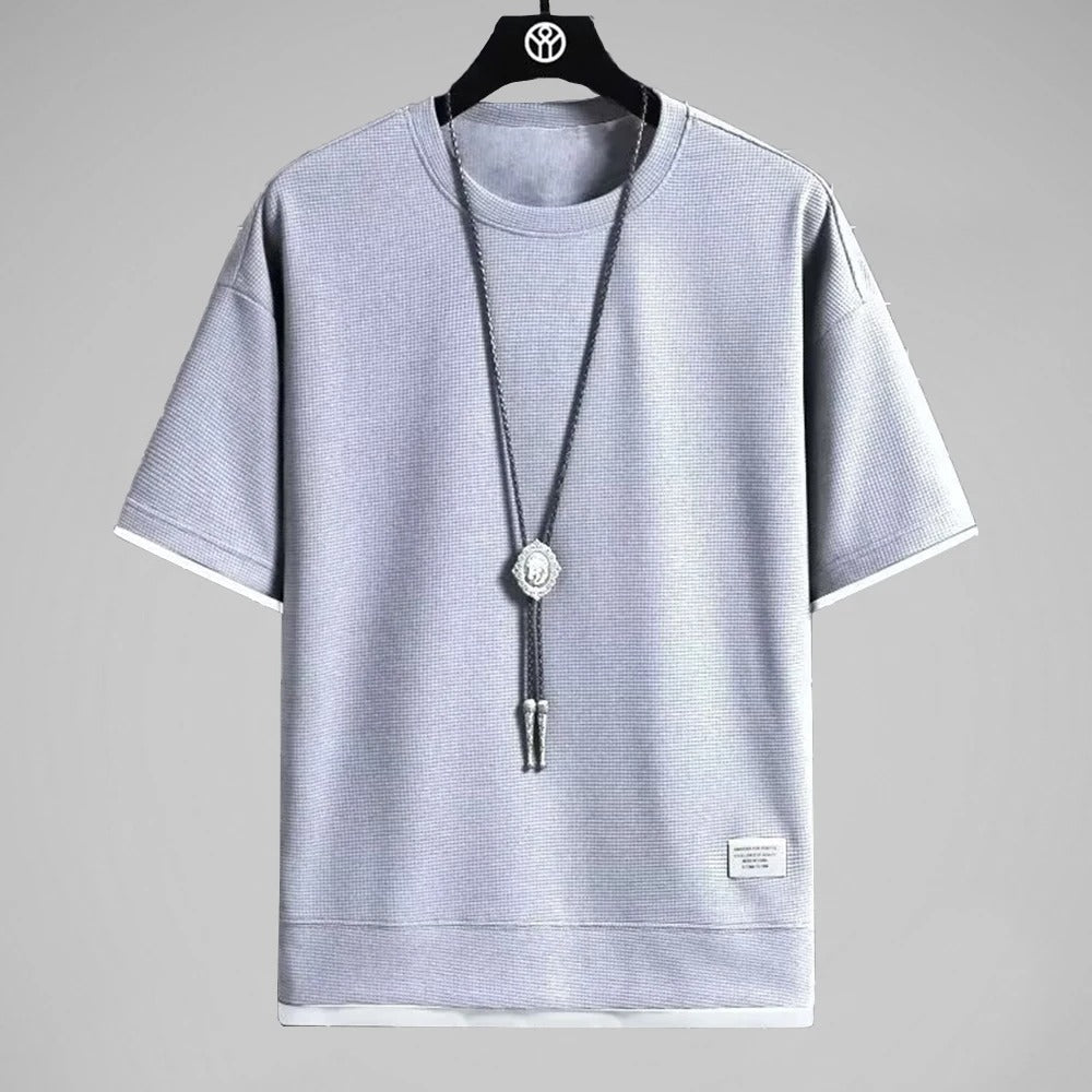 "Ultramjuk herr våffel-T-shirt i premiumkvalitet med kort ärm och ventilerande struktur, stilfull och bekväm look."