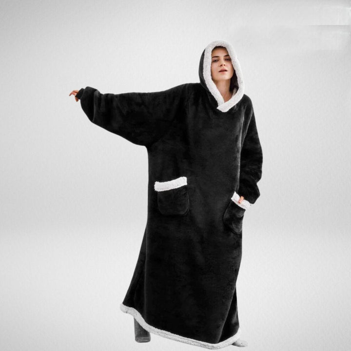 Unisex oversize filt med huva av microfleece sherpa, mjukt material och värmande foder, perfekt för komfort.
