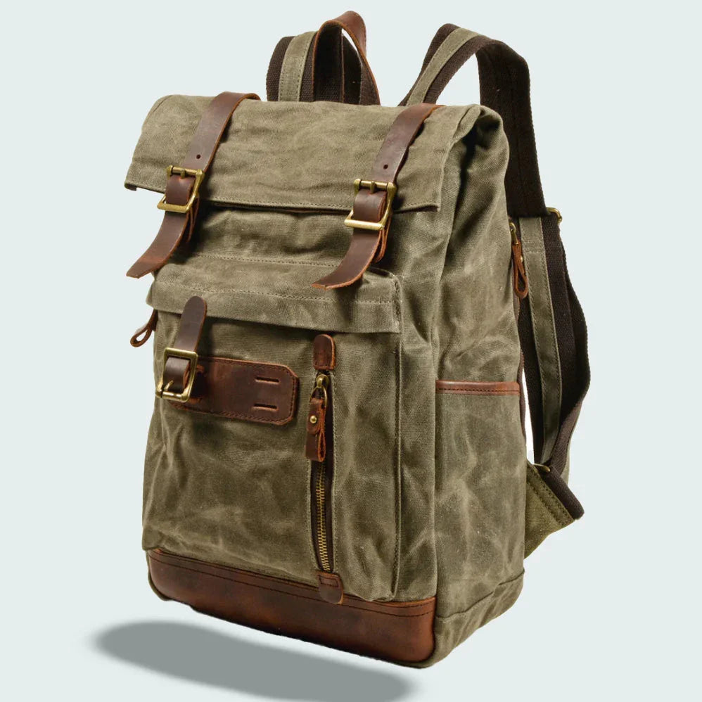 "Unisex vikbar vintage ryggsäck i vaxad canvas, stilren och funktionell, med vadderade axelremmar och flera fickor."