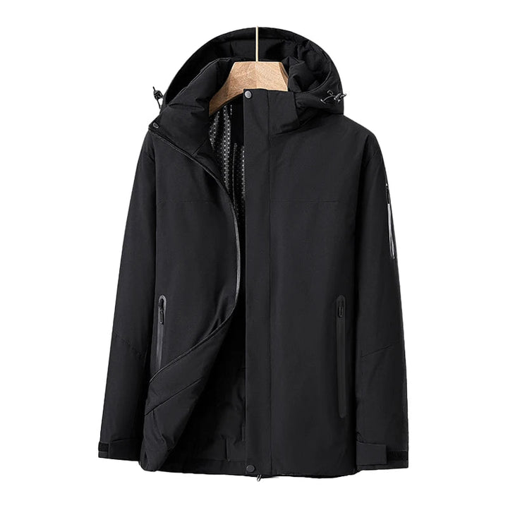 Vattentät damjacka i blå kvilt med avtagbar hätta, fickor, modern stil, perfekt för vinter och dåligt väder.
