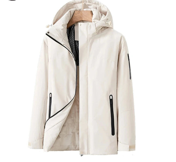 Vattentät damjacka i blå kvilt med avtagbar hätta, fickor, modern stil, perfekt för vinter och dåligt väder.