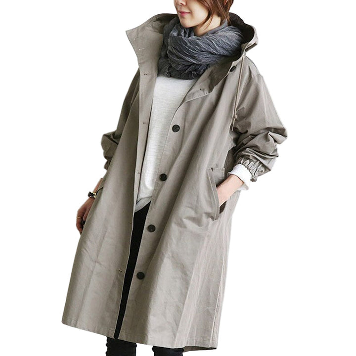 "Vattentät damjacka trenchcoat med modern design, elegant snitt och klassiska detaljer för vardagsbruk."