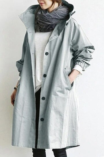 "Vattentät damjacka trenchcoat med modern design, elegant snitt och klassiska detaljer för vardagsbruk."